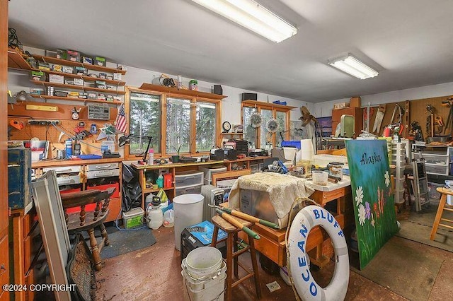 interior space featuring concrete floors and a workshop area