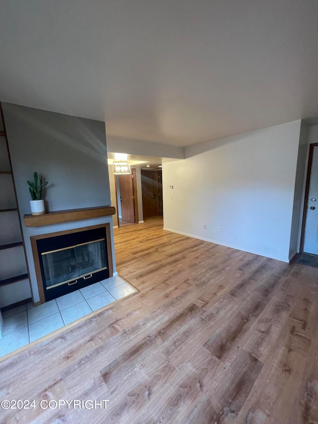 unfurnished living room featuring light wood-type flooring