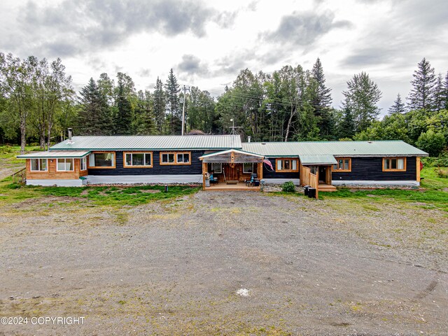 single story home with covered porch