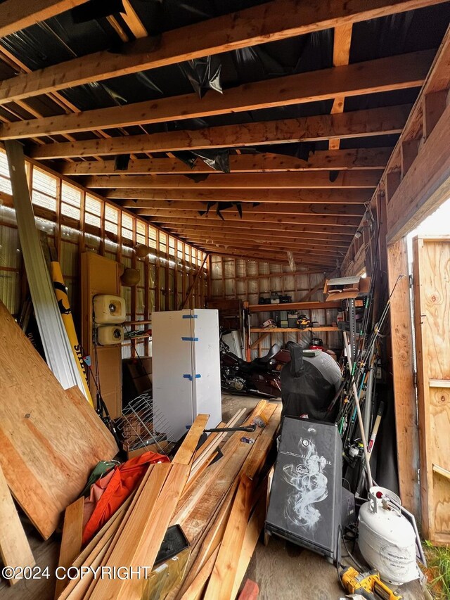 miscellaneous room featuring lofted ceiling