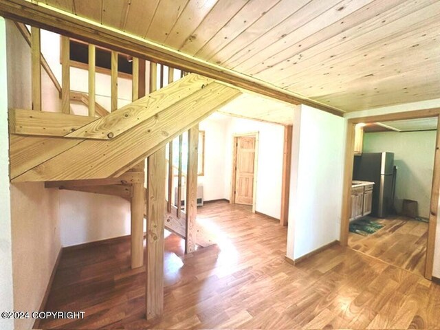 bonus room featuring wooden ceiling and hardwood / wood-style flooring