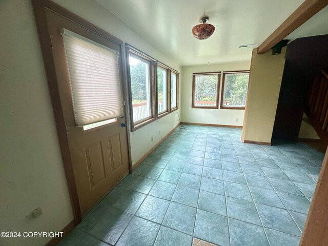 interior space featuring light tile patterned flooring