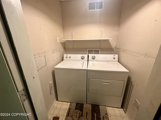 laundry room with washer and clothes dryer