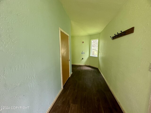 corridor with hardwood / wood-style floors