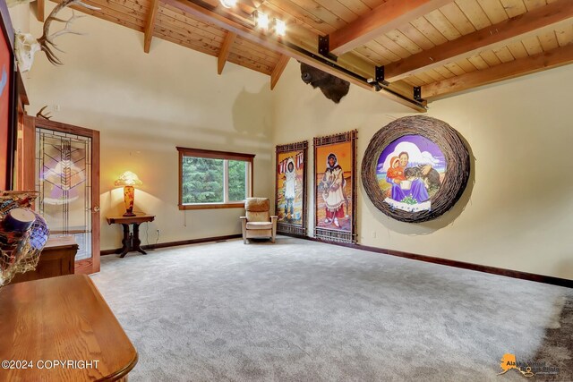 unfurnished room featuring wooden ceiling, vaulted ceiling with beams, and carpet floors