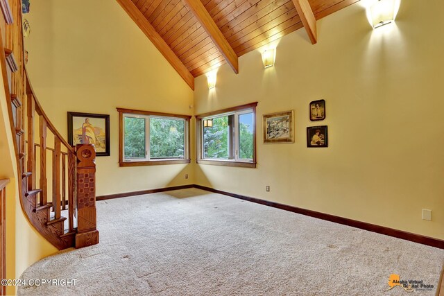 interior space featuring beam ceiling, wood ceiling, and high vaulted ceiling