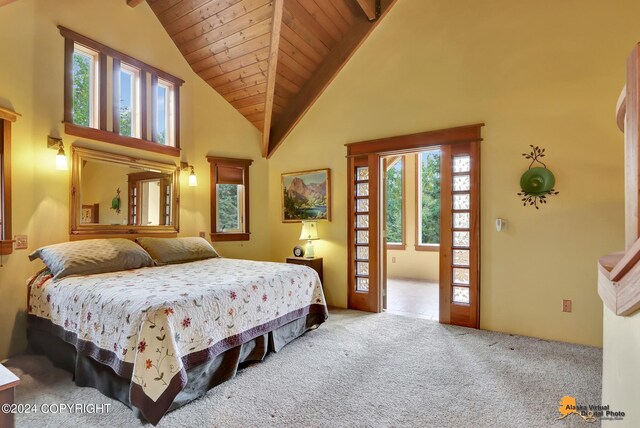 carpeted bedroom with wooden ceiling, multiple windows, high vaulted ceiling, and beam ceiling