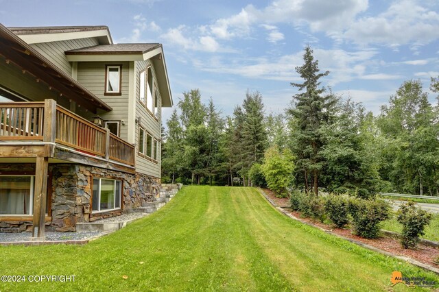 view of yard with a wooden deck