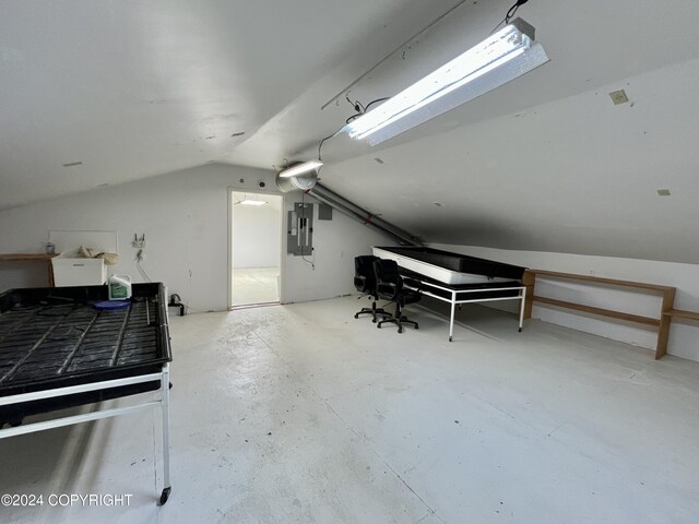 bonus room with vaulted ceiling and electric panel