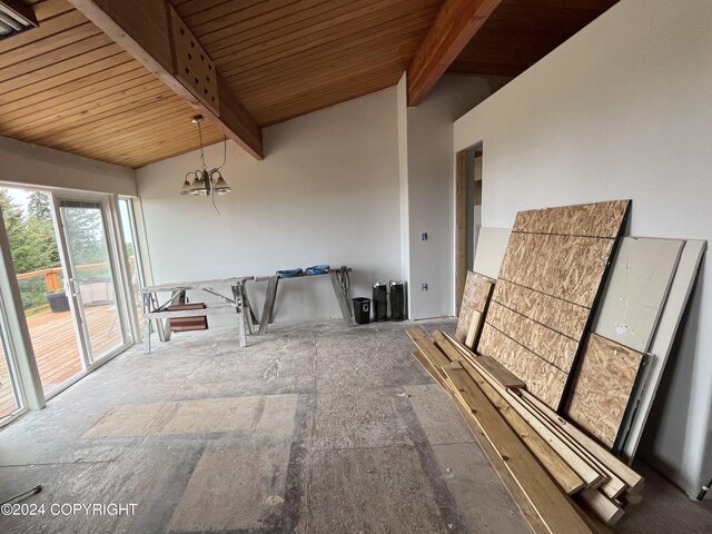 interior space featuring a notable chandelier, wooden ceiling, and lofted ceiling with beams