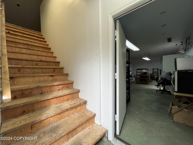 stairs with concrete floors