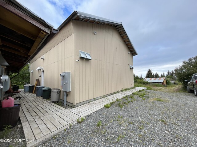 view of side of property featuring a wooden deck