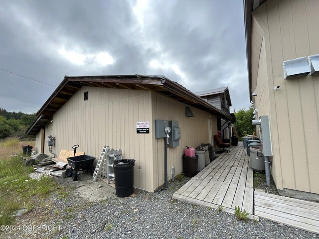 view of side of property featuring a deck