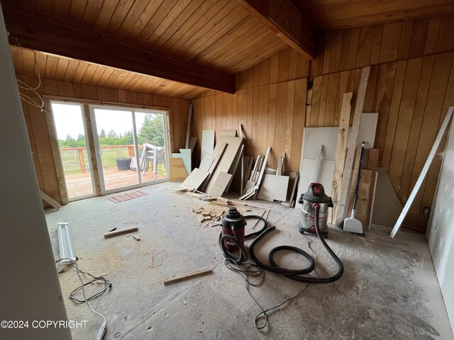 misc room featuring vaulted ceiling with beams, wooden walls, and wooden ceiling