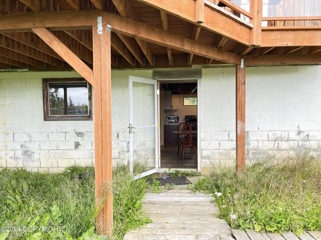 property entrance with a deck