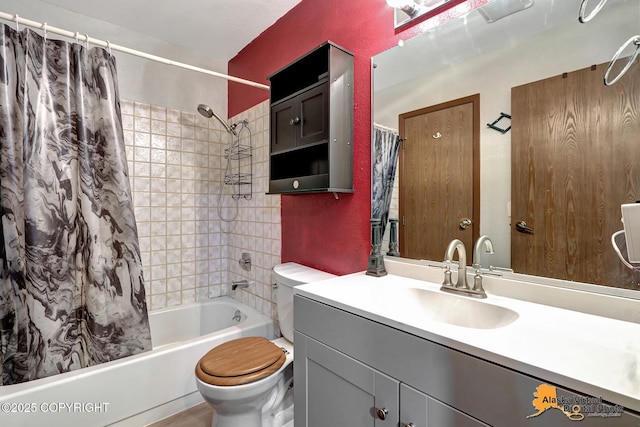 full bathroom featuring toilet, vanity, and shower / tub combo