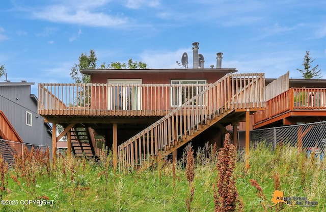 rear view of house featuring a deck