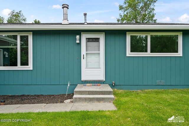 12230 Rainbow Ave, Anchorage, AK 99516 - entrance to property featuring a lawn