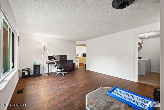 12230 Rainbow Ave, Anchorage, AK 99516 - office with washer / dryer, wood finished floors, and a textured ceiling
