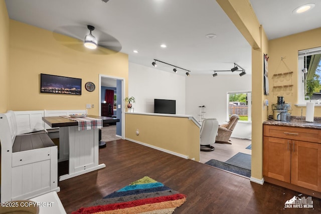12230 Rainbow Ave, Anchorage, AK 99516 - kitchen with open floor plan, ceiling fan, dark wood-type flooring, brown cabinets, and rail lighting