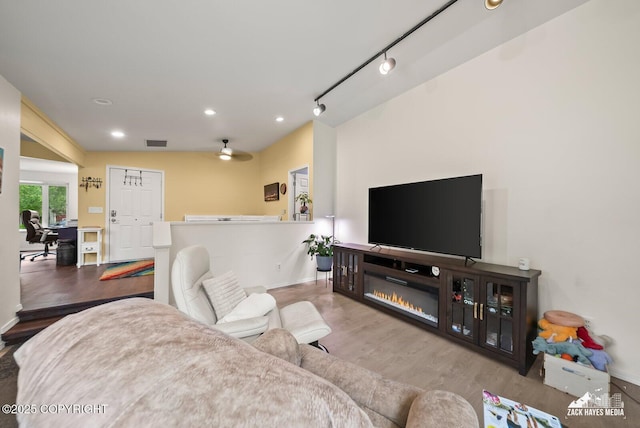 12230 Rainbow Ave, Anchorage, AK 99516 - living room featuring an office area, wood finished floors, recessed lighting, and ceiling fan