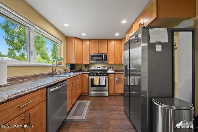 12230 Rainbow Ave, Anchorage, AK 99516 - kitchen with stainless steel appliances, dark wood-style flooring, recessed lighting, dark countertops, and brown cabinets