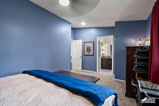 12230 Rainbow Ave, Anchorage, AK 99516 - carpeted bedroom with ensuite bath and baseboards