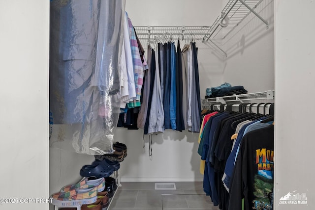 12230 Rainbow Ave, Anchorage, AK 99516 - walk in closet with tile patterned flooring