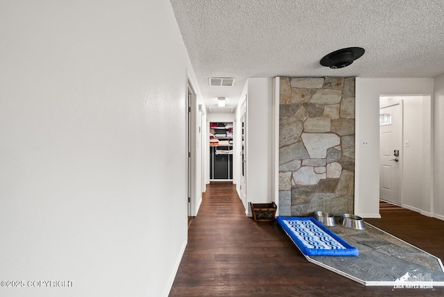 12230 Rainbow Ave, Anchorage, AK 99516 - hallway with wood finished floors and a textured ceiling