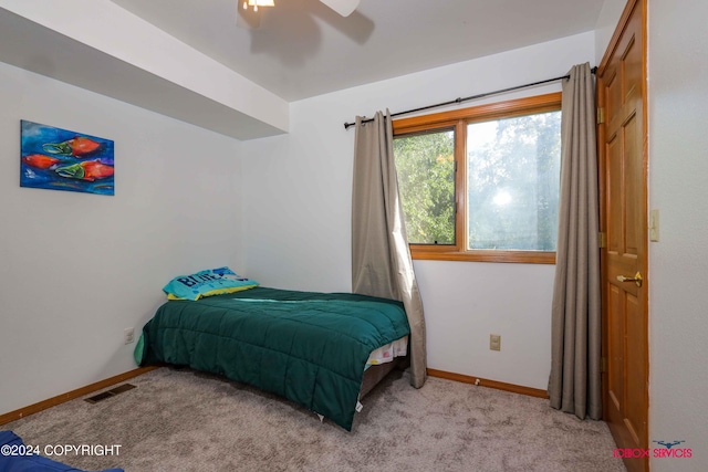 bedroom featuring ceiling fan, carpet flooring, visible vents, and baseboards