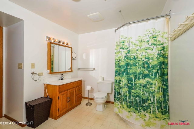 bathroom featuring tile patterned flooring, toilet, walk in shower, and vanity