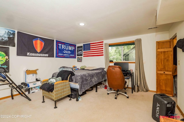 carpeted bedroom with recessed lighting, visible vents, and baseboards