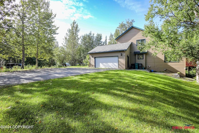 view of property exterior featuring a garage, a lawn, a shingled roof, and aphalt driveway