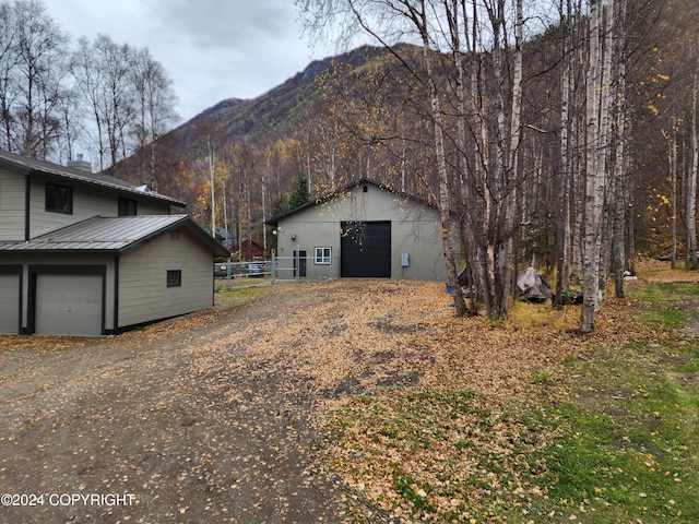 view of home's exterior featuring a mountain view and a garage