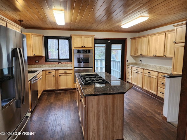 kitchen with appliances with stainless steel finishes, dark wood-type flooring, a healthy amount of sunlight, and wood ceiling