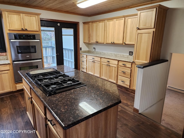 kitchen with dark wood-type flooring, wooden ceiling, black gas cooktop, double oven, and crown molding