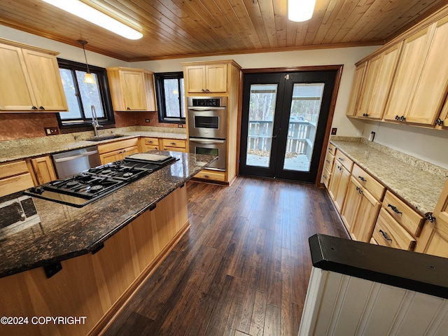 kitchen with french doors, light brown cabinets, dark hardwood / wood-style flooring, decorative light fixtures, and appliances with stainless steel finishes