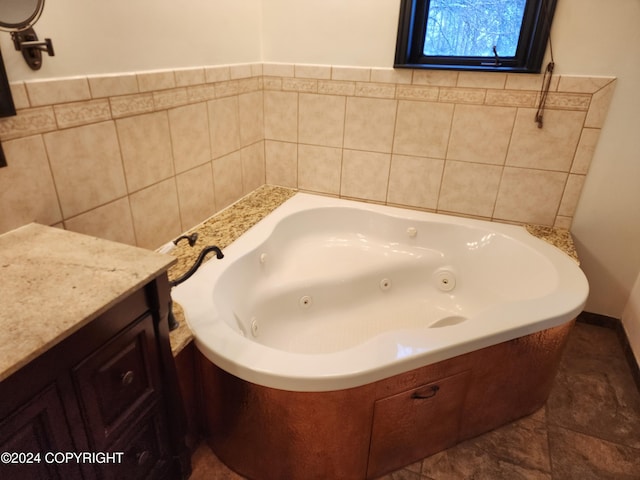 bathroom with tile patterned floors and a bathing tub