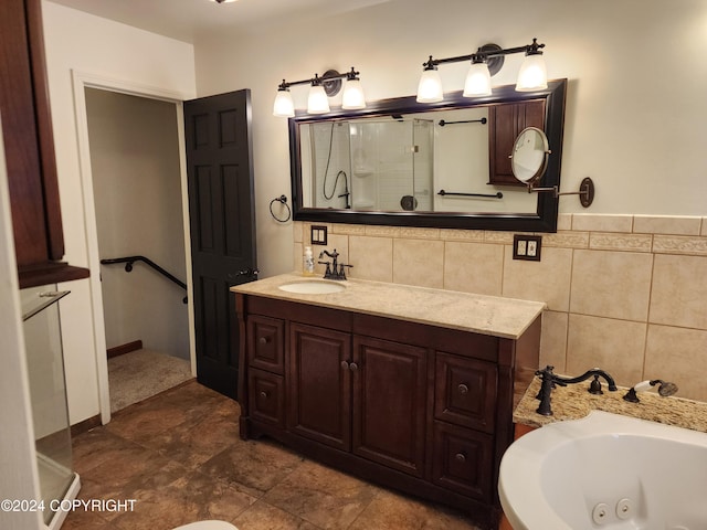 bathroom with vanity, tile walls, and plus walk in shower