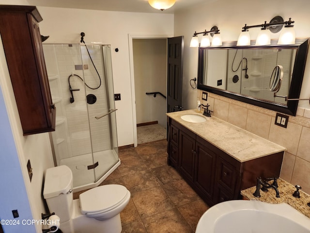 bathroom with tasteful backsplash, tile patterned floors, vanity, a shower with door, and toilet