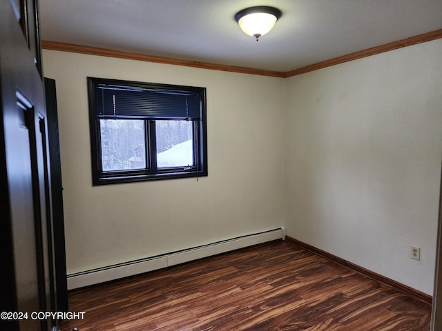 empty room with a baseboard radiator, dark hardwood / wood-style floors, and ornamental molding