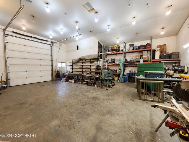 20527 Mark Cir, Chugiak, AK 99567 - garage featuring a workshop area