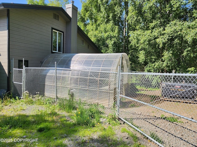 20527 Mark Cir, Chugiak, AK 99567 - view of property exterior featuring a chimney