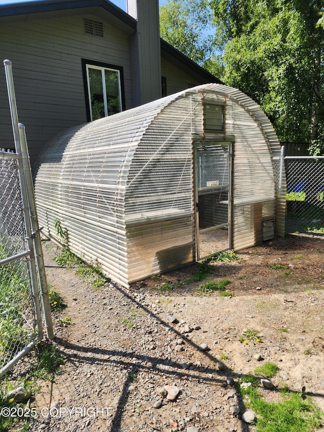 20527 Mark Cir, Chugiak, AK 99567 - view of property exterior featuring an outbuilding and a chimney