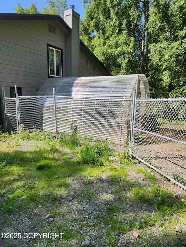 20527 Mark Cir, Chugiak, AK 99567 - view of side of property featuring a chimney