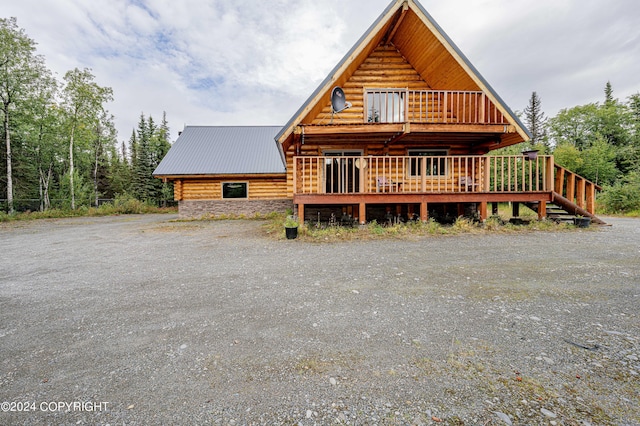 view of front of property with a wooden deck