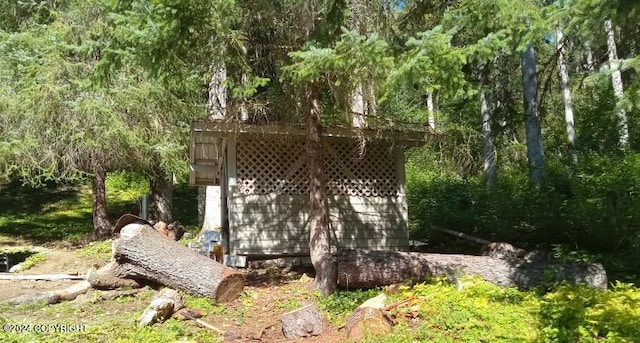 exterior space featuring a forest view