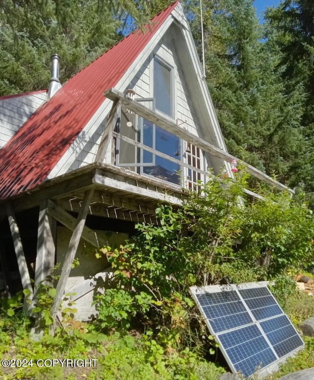 view of home's exterior with solar panels