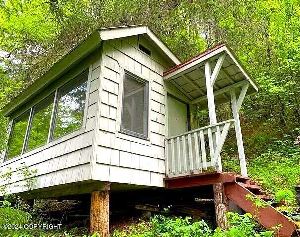 L13B8 Chilkat Lk, Haines, AK 99827 - view of property exterior featuring a view of trees