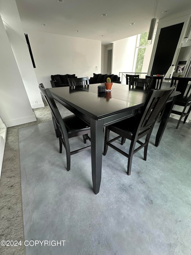 dining space with concrete floors